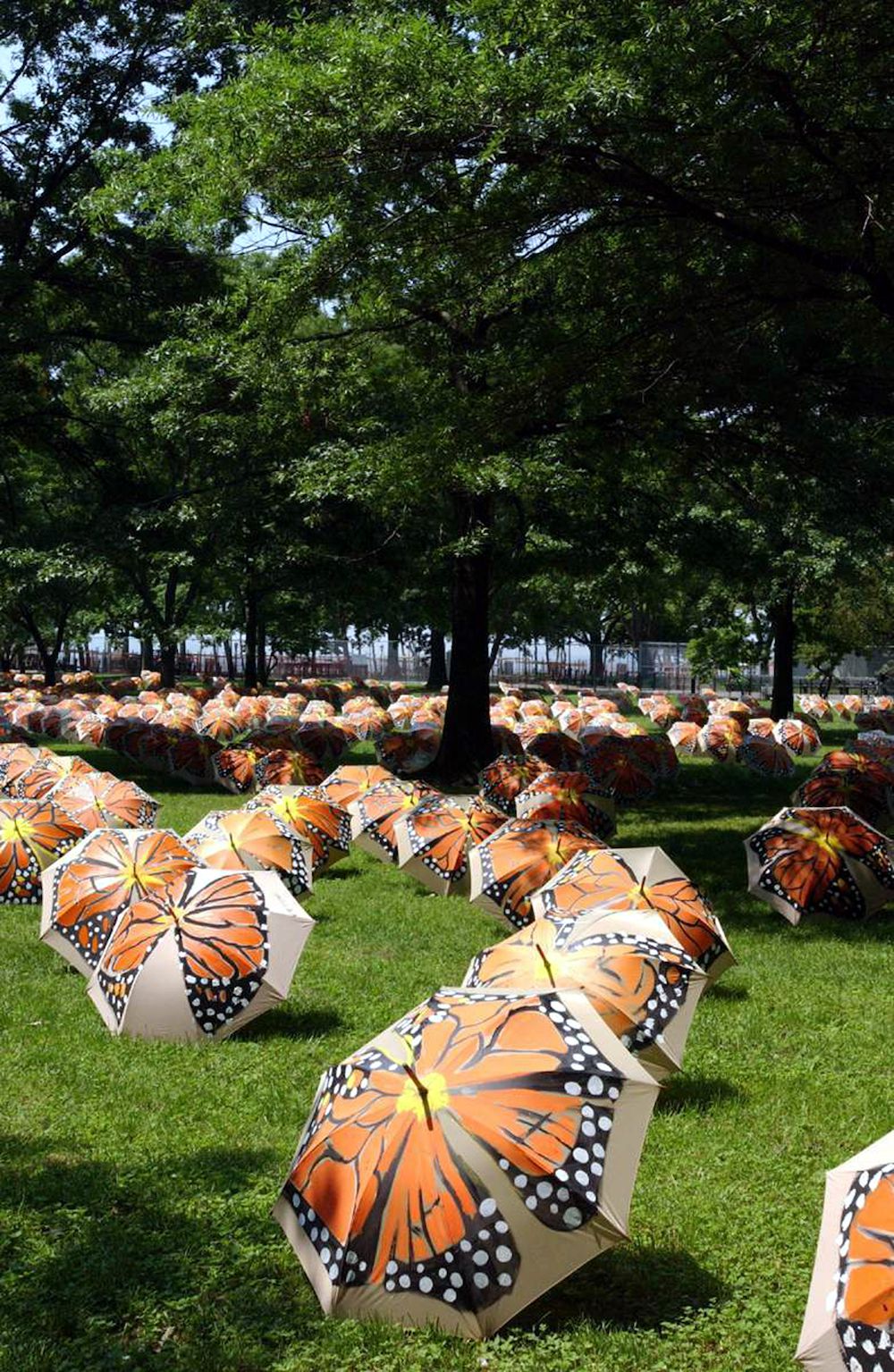 Victor Matthews, Beyond Metamorphosis, 2004, Battery Park, Manhattan, A project sponsored by the Lower Manhattan Cultural Council, NYC Parks. Matthews installed nearly 3,000 umbrellas, each individually hand-painted with a rendering of a Monarch butterfly. “The piece explores themes of transformation, migration and regeneration,” says Matthews. “Butterflies make an obvious spiritual gesture that’s often overlooked: of a life that never ends and a spirit that never dies,” said Matthews.<br/>